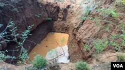 Pits dug by the Insiza Chinese Mining Company