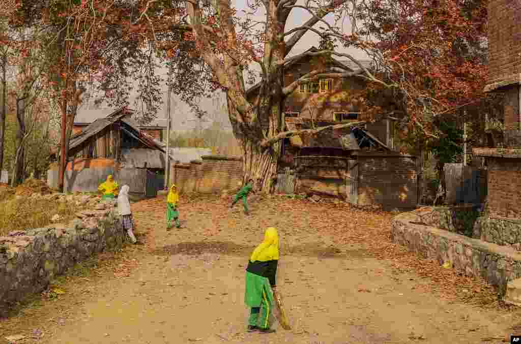 Kashmiri school children play cricket on the outskirts of Srinagar, Indian-controlled Kashmir.