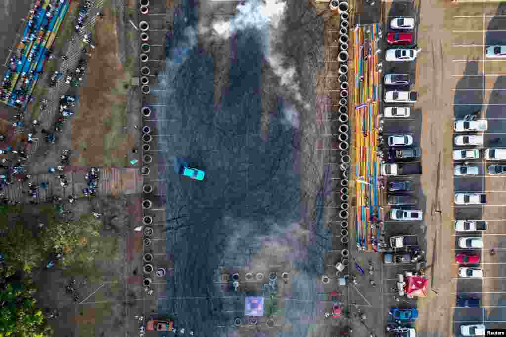A drone picture shows a spinner demonstrating his skills at the Eswatini Spin Explosion, in Manzini, Eswatini, Dec. 2, 2023.