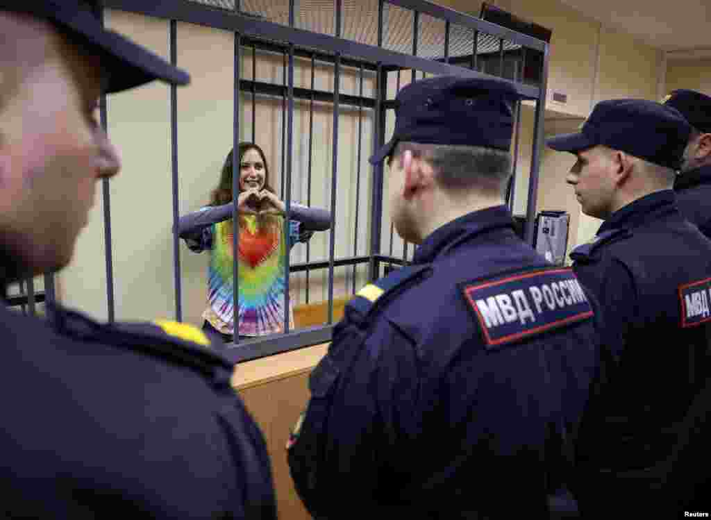 Alexandra (Sasha) Skochilenko, a 33-year-old artist and musician, who faces charges of spreading false information about the army after replacing supermarket price tags with slogans protesting against Russia's military operation in Ukraine, reacts during a court hearing in Saint Petersburg.