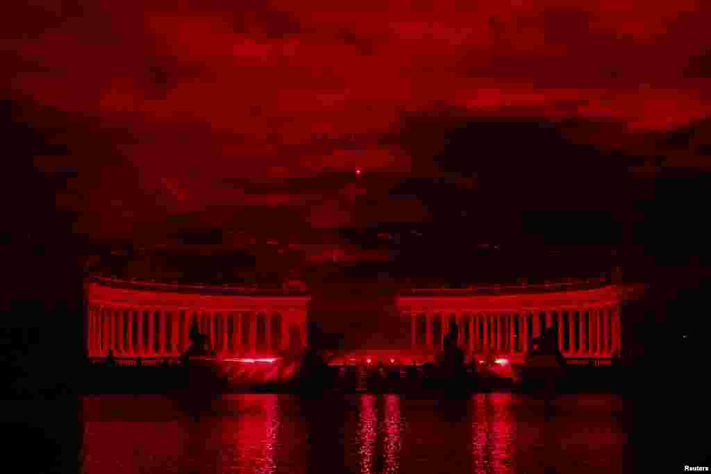 The front of the Alfonso XII monument at El Retiro Park is illuminated with a light installation by artist Juan Gomez-Cornejo as part of LuzMadrid, the International Festival of Light in Madrid, Spain, Oct. 28, 2023.