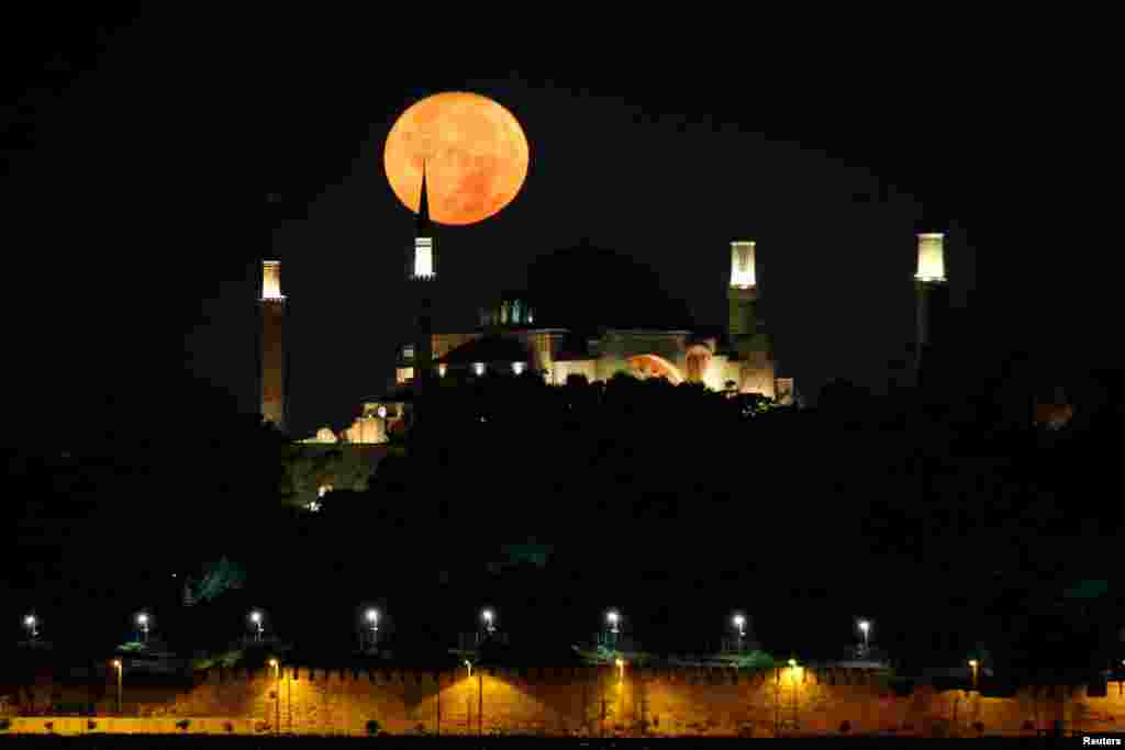 The moon is pictured over the Ayasofya-i Kebir Camii or Hagia Sophia Grand Mosque in Istanbul, Turkey.