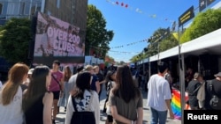 FILE - Students walk past stalls during the orientation week at The University of Sydney, in Camperdown, Australia February 15, 2023. (REUTERS/ Stella Qiu/File Photo)