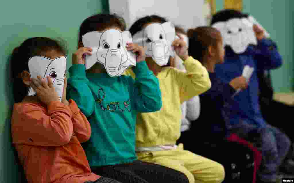 Refugee children play at the kindergarten in the first reception center for refugees in Giessen, Germany.