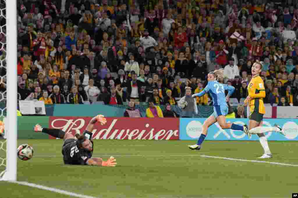 Australia&#39;s goalkeeper Mackenzie Arnold fails to save the goal from England&#39;s Alessia Russo, 2nd right, during the Women&#39;s World Cup semifinal soccer match between Australia and England at Stadium Australia in Sydney.