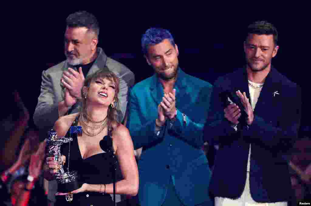 Taylor Swift receives the Best Pop award from NSYNC members during the 2023 MTV Video Music Awards at the Prudential Center in Newark, New Jersey, Sept. 12, 2023.