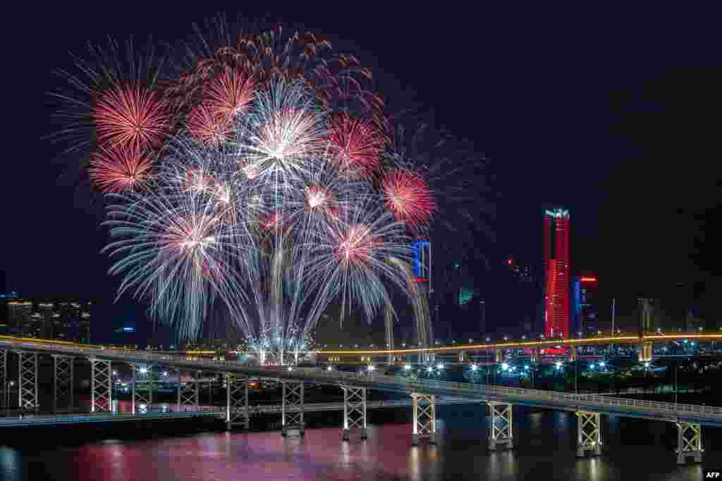 A fireworks display by the United Kingdom's team lights up the sky near the Macau Tower shorefront during the 31st Macau International Fireworks Contest, in Macau.