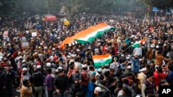 In this file photo, Indians gather for a protest against the Citizenship Amendment Act after Friday prayers outside Jama Masjid in New Delhi, India, Dec. 20, 2019. (AP Photo/Altaf Qadri, File)