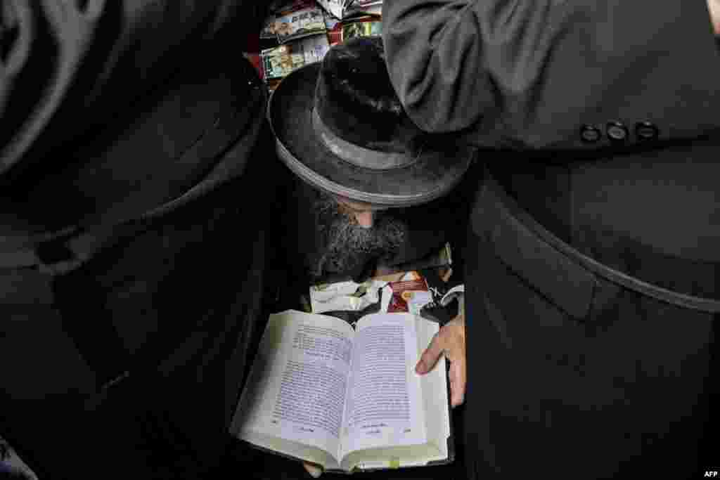 Hasidic Jewish pilgrims pray at the tomb of Rabbi Nachman, ahead of the Jewish new year of Rosh Hashanah, in Uman, central Ukraine. Over 20,000 Jewish pilgrims have arrived in Uman for Rosh Hashanah, despite warnings from Kyiv not to travel for the religious holiday due to the Russian invasion.