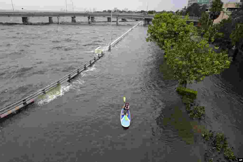 Flood waters is seen pushed by Hurricane Idalia over the sea wall along Old Tampa Bay in Tampa, Florida.