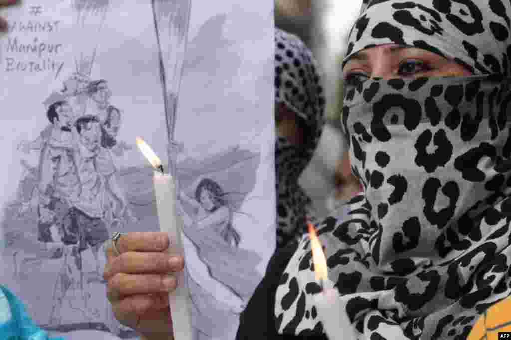 Congress workers take part in a candlelight vigil over sexual violence against women in the ongoing ethnic violence in India&#39;s north-eastern state of Manipur, in Amritsar.&nbsp;Indian police have arrested four men accused of parading two women naked in front of a mob in a northeastern state where months of ethnic violence have left at least 120 dead.&nbsp;