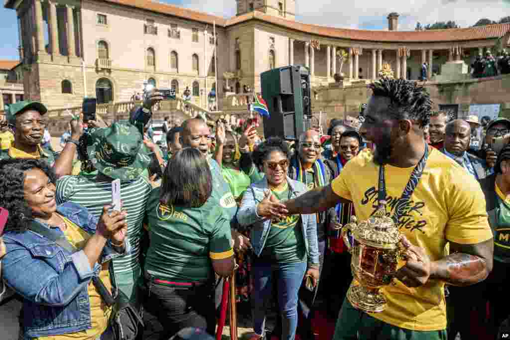 Springbok captain Siya Kolisi greets fans as the team arrive at the Union Buildings for the start of their trophy tour after winning the 2023 Rugby World Cup, in Pretoria, South Africa.