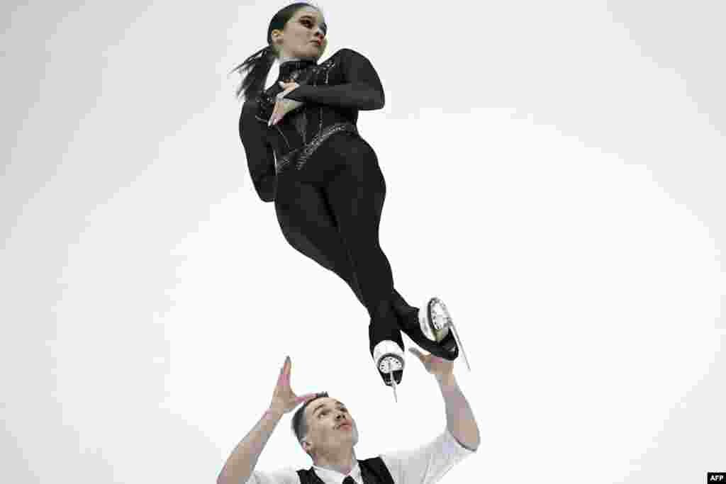 Hungary's Maria Pavlova and Alexei Sviatchenko compete in the pairs short program during the ISU Grand Prix of Figure Skating Final in Beijing, China.