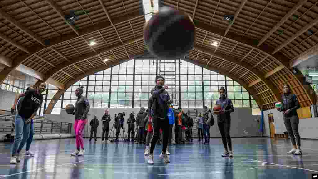 Cuban athletes who competed in the Pan American Games play basketball in a Santiago, Chile, gym with other athletes who abandoned their delegation after the Games and are seeking refugee status in Chile.
