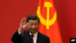 FILE - Chinese President Xi Jinping waves at an event to introduce new members of the Politburo Standing Committee at the Great Hall of the People in Beijing on Oct. 23, 2022. (AP Photo/Andy Wong, File)