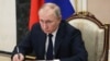 In this file photo, Russian President Vladimir Putin chairs a meeting with members of the government via teleconference in Moscow, Thursday, March 10, 2022. (Mikhail Klimentyev, Sputnik, Kremlin Pool Photo via AP, File)