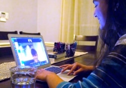 FILE - Charvi Goyal, 17, gives an online math tutoring session on Jan. 4, 2021, in Plano, Texas.
