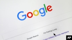 FILE - In this Tuesday, Aug. 28, 2018, file photo, a cursor moves over Google's search engine page, in Portland, Ore.