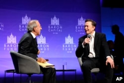 Baron Capital Group Chairman and CEO Ron Baron interviews Tesla CEO Elon Musk at the 29th Annual Baron Investment Conference in New York City on Friday, Nov. 4, 2022. (Hewes Communications, Inc. via AP)