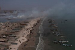 Fishing boats line the shore of Bargny beach, some 35 kilomters (22 miles) east of Dakar, Senegal, Thursday April 22, 2021.