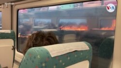 España: Pasajeros sobre tren ven llamas al fondo