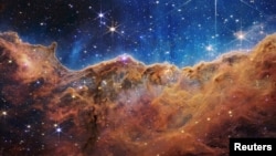 The "Cosmic Cliffs" of the Carina Nebula are seen in this image, captured by NASA's James Webb Space Telescope and released on July 12, 2022. (Image Credit: NASA, ESA, CSA, STScI, Webb ERO Production Team/Handout via REUTERS)