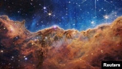 The "Cosmic Cliffs" of the Carina Nebula are seen in this image, captured by NASA's James Webb Space Telescope and released on July 12, 2022. (Image Credit: NASA, ESA, CSA, STScI, Webb ERO Production Team/Handout via REUTERS)