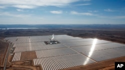 FILE - An aerial view of a solar power plant in Ouarzazate, central Morocco on Feb.4, 2016. Renewable energy's potential across the African continent remains largely untapped, according to a new report in April 2022 by the United Nation's Intergovernmental Panel on Climate Change. (AP Photo/Abdeljalil Bounhar, File)