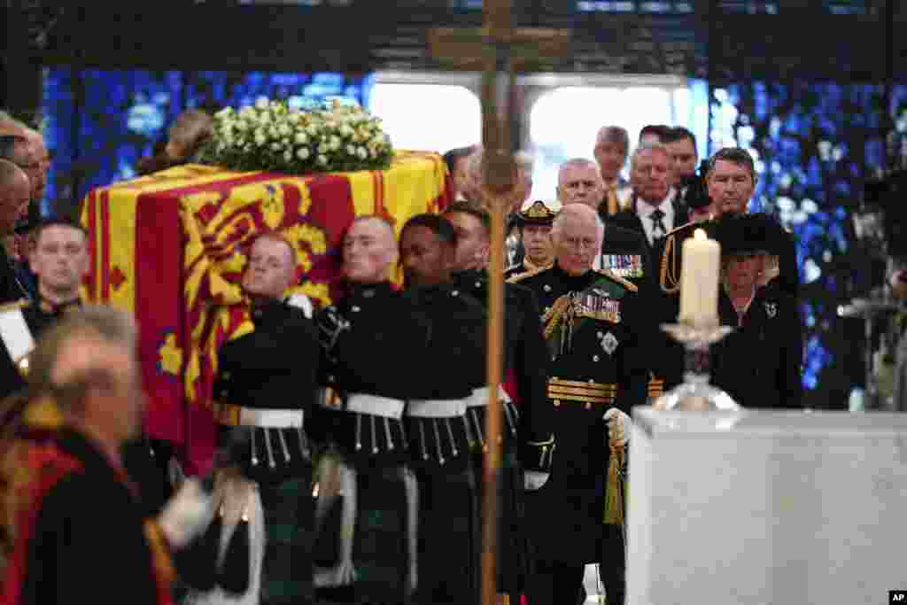Center from front, Britain's King Charles III and Camilla, the Queen Consort, Princess Anne and Tim Laurence, and Prince Andrew follow the coffin as they enter the cathedral for a Service of Prayer and Reflection for the Life of Queen Elizabeth II at St. Giles' Cathedral, Edinburgh, Sept. 12, 2022.