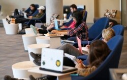 Students look out over the campus as they work on computers at the renovated James Branch Cabell library on the campus of Virginia Commonwealth University in Richmond, Va., Thursday, April 28, 2016.