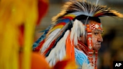 FILE - Butch McIntosh wears traditional Native American regalia at the Pow Wow of Champions on the fairgrounds in Tulsa, Okla. Saturday Aug. 11, 2007. 
