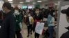 Parents and children at a children's hospital in Beijing on Oct. 30, 2023, during a surge in respiratory illnesses across China. 