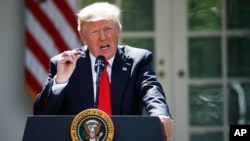President Donald Trump speaks about the U.S. role in the Paris climate change accord, Thursday, June 1, 2017, in the Rose Garden of the White House in Washington. (AP Photo/Pablo Martinez Monsivais)
