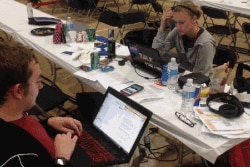 Tyler Skluzacek and another team member at a competition called HackDC, a 36-hour coding competition, teamed up with two other participants from other universities to create the myBivy smartphone/smartwatch application, in Washington, D.C. (Courtesy photo
