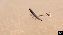 In this photo released by Solar Impulse, "Solar Impulse 2", a solar-powered airplane flies after taking off from Al Bateen Executive Airport in Abu Dhabi, United Arab Emirates, March 9, 2015.