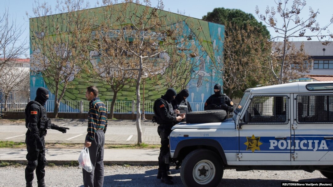 Montenegro, Podgorica, Police checks a man after the government tightens up measures for coronavirus 