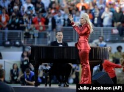 Lady Gaga sings the national anthem before the NFL Super Bowl 50 football game between the Denver Broncos and the Carolina Panthers, Sunday, Feb. 7, 2016, in Santa Clara, Calif.
