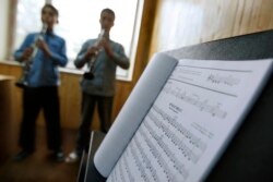 FILE - In this May 11, 2010 file photo, students learn to play music at the Afgan National Institute of Music, ANIM, in Kabul, Afghanistan.