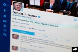 FILE - Photo shows Trump's Twitter feed, now called X, on a computer screen in Washington on April 3, 2027. (AP Photo/J. David Ake, File)