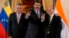 Venezuela's President Nicolas Maduro, center, and Executive Director of Oil and Natural Gas Corporation, el jefe de estado afirmó que solicitó al ministro de Petróleo, Eulogio Del Pino (derecha), tomar acciones legales ante las recientes informaciones que publicó JP Morgan.