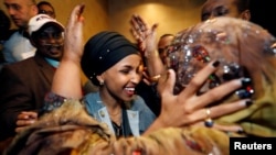 Democratic congressional candidate Ilhan Omar is greeted by her husband’s mother after appearing at her midterm election night party in Minneapolis, Minnesota, Nov. 6, 2018. 