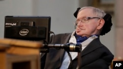 FILE - In this March 6, 2017, photo, Stephen Hawking receives the Honorary Freedom of the City of London. Cambridge University has put Hawking's doctoral thesis online, Oct. 23, 2017. "Properties of Expanding Universes" explores ideas about the origins of