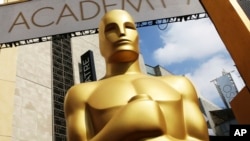 FILE - An Oscar statue appears outside the Dolby Theatre for the 87th Academy Awards in Los Angeles on February 21, 2015. (Photo by Matt Sayles/Invision/AP, File)