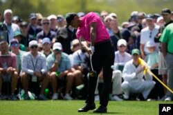 Tiger Woods hits his tee shot on the eighth hole April 7, 2022, in Augusta, Ga. (AP Photo/Matt Slocum)