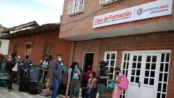 People line up in front of the formation house of the Zijin mine in Buritica, Colombia, on April 19, 2021. REUTERS/Luisa Gonzalez