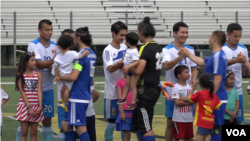 Uyghur American Cup players greet one another before the start of the tournament.