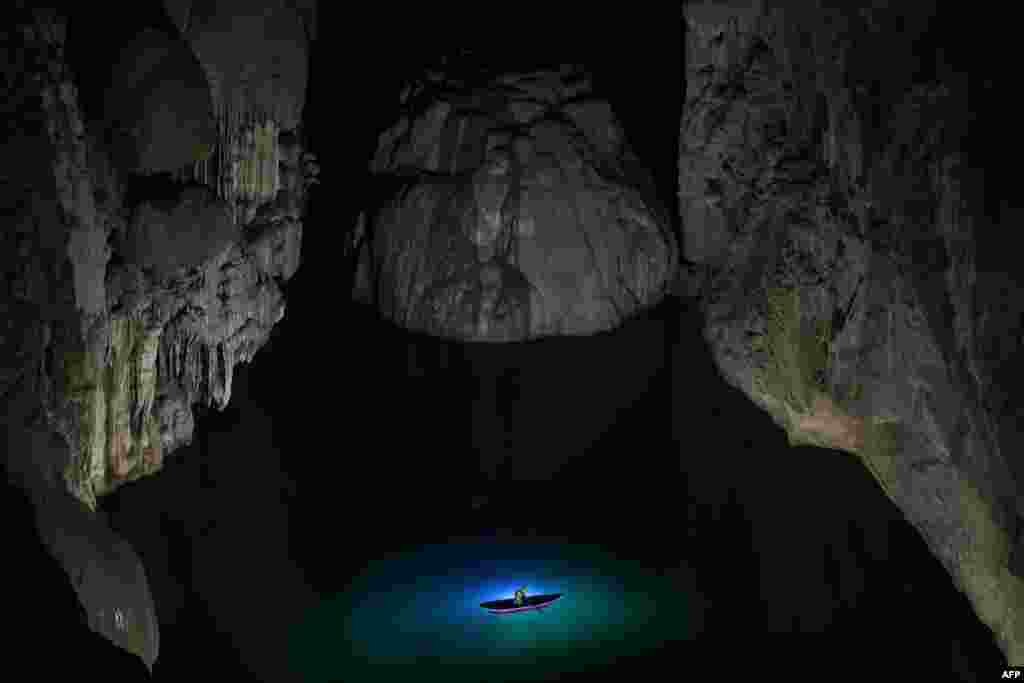 A visitor takes part in a tour in Son Doong cave, one of the world&#39;s largest natural caves, in central Vietnam&#39;s Quang Binh province.