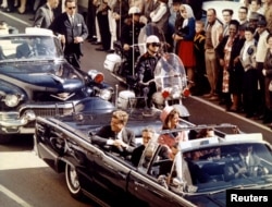 The Kennedys and Texas Governor John Connally ride through Dallas moments before Kennedy was assassinated on November 22, 1963.