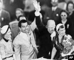 FILE - The Checkers speech taught politicians the importance of TV in creating a public image. It also helped Nixon and Eisenhower win the presidential election of 1952. They are pictured here with their wives.