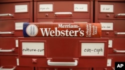 FILE - A Merriam-Webster dictionary sits atop their citation files at the dictionary publisher's offices on Dec. 9, 2014, in Springfield, Mass. Merriam-Webster's word of the year for 2023 is “authentic.” (AP Photo/Stephan Savoia, File)